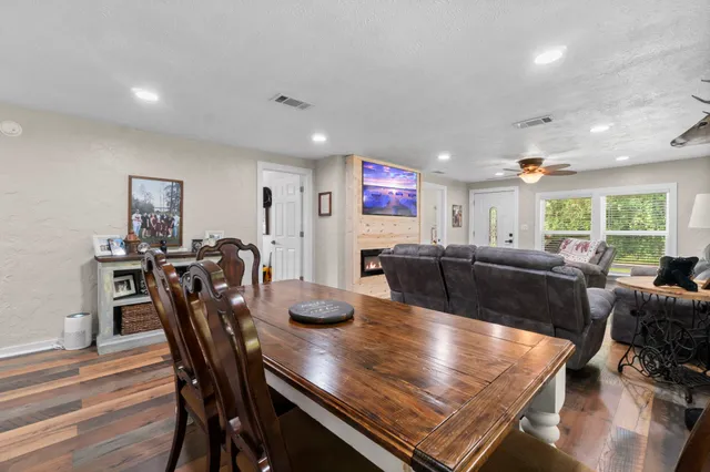 a large kitchen with a table and chairs