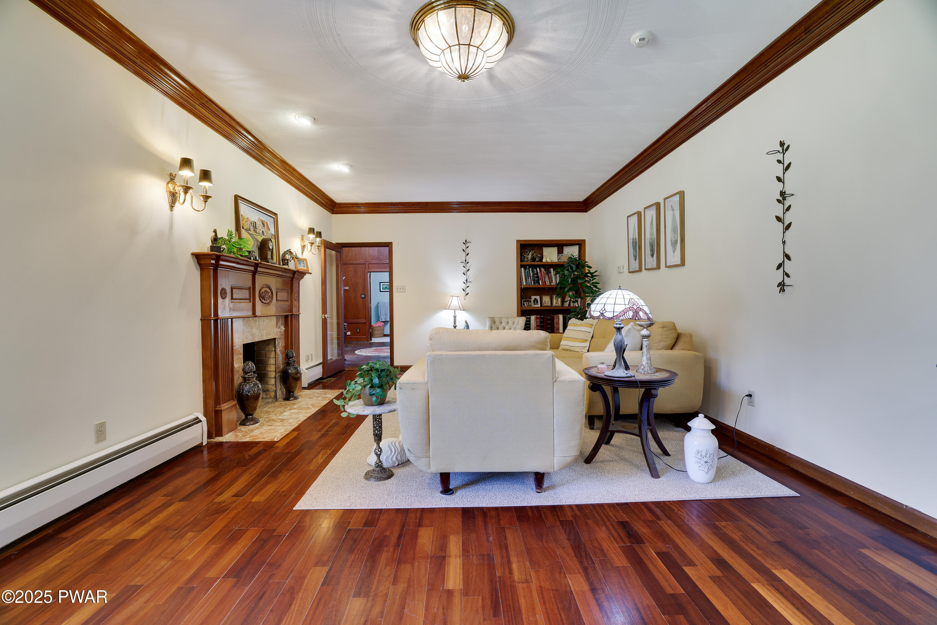 555 Valley View Road Dallas, PA 18612 - Photo 22 of 99 a living room with furniture a fireplace and wooden floor