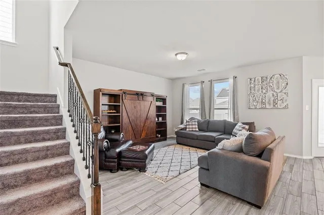 a living room with furniture and a couch
