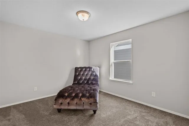 a room with a wooden floor and a window