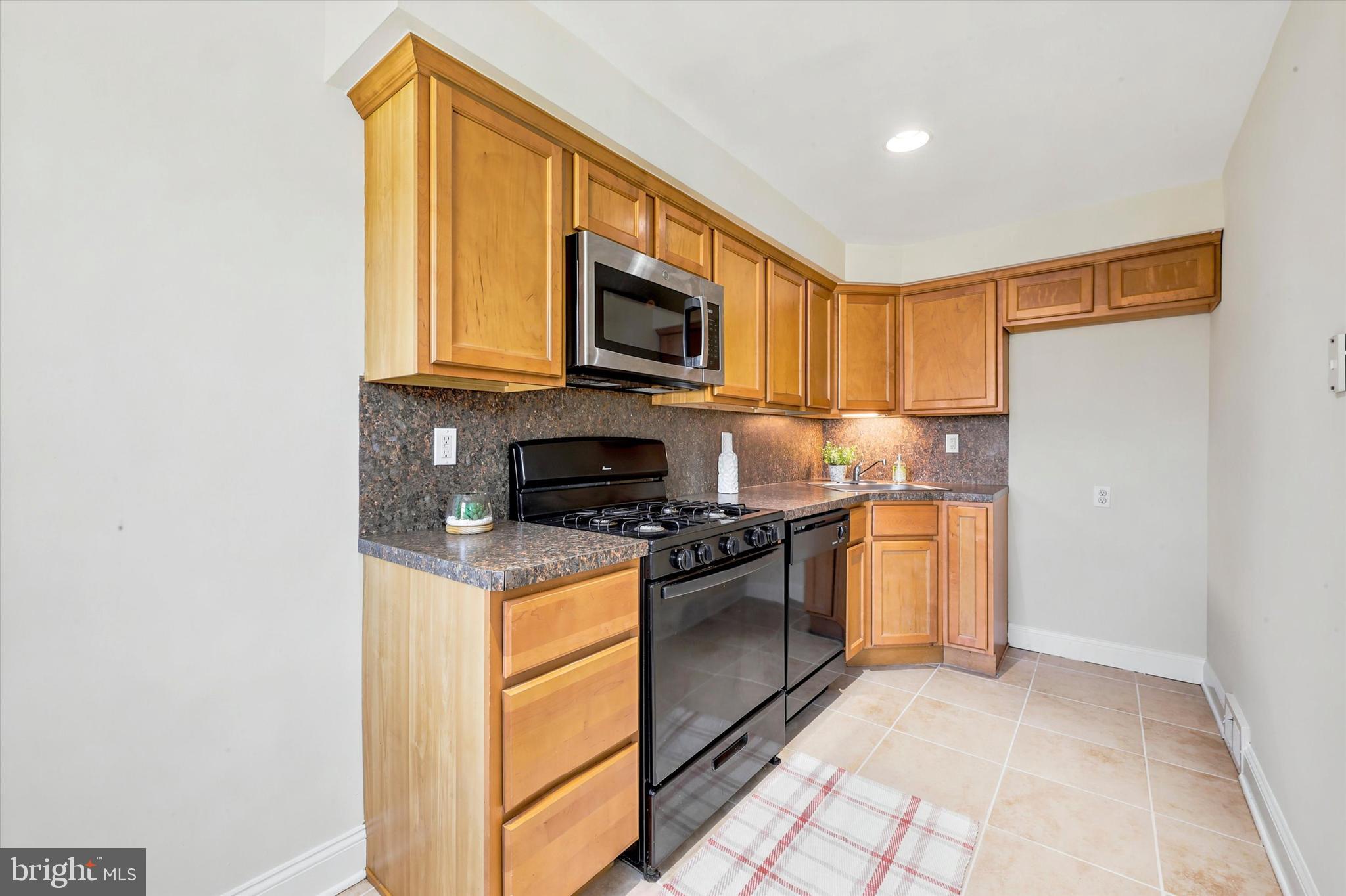 1129 Stratford Road Glenolden, PA 19036 - Photo 8 of 25 Upgraded Kitchen w/d/w,stove-oven and microwave