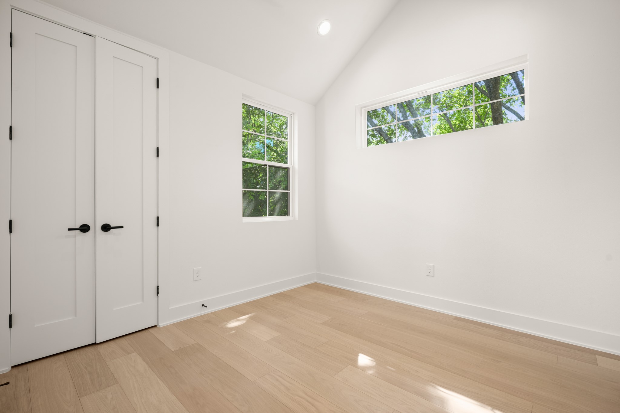 601 Vermont Road, Unit 2 Austin, TX 78702 - Photo 22 of 31 Hardwood floors and bright windows create an inviting, open atmosphere.