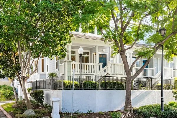 front view of a house with a tree