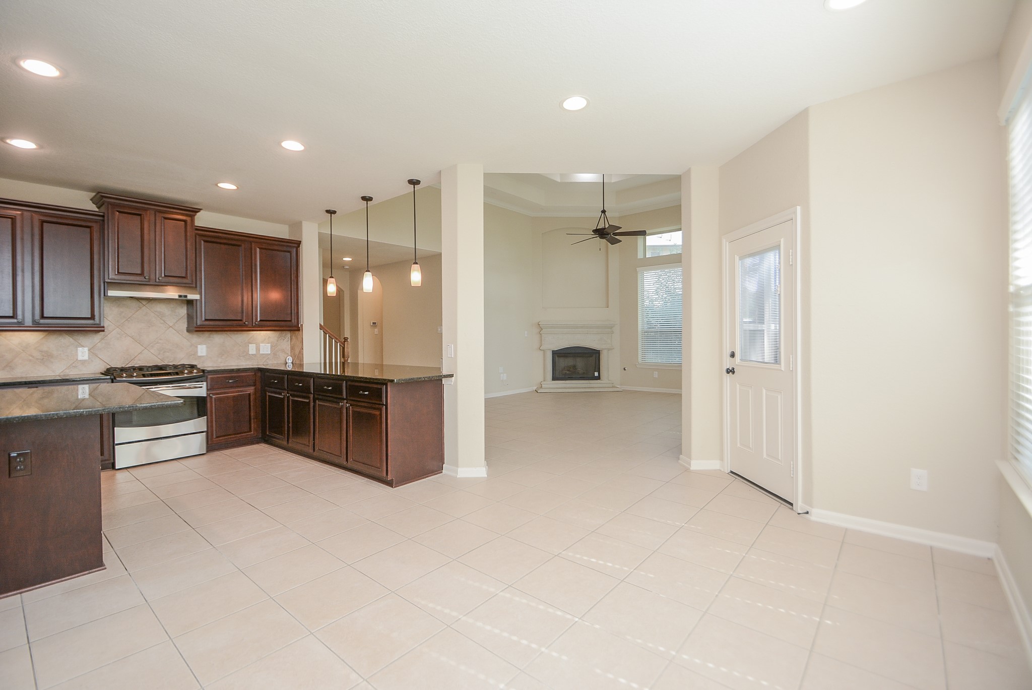 50 Sawbridge Court Spring, TX 77389 - Photo 11 of 32 a large kitchen with a large counter top appliances and cabinets
