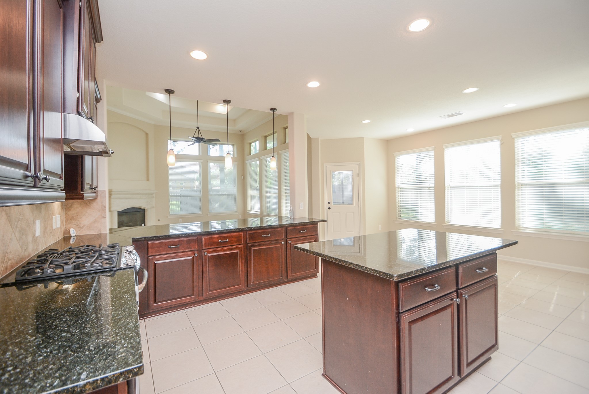 50 Sawbridge Court Spring, TX 77389 - Photo 15 of 32 a kitchen with stainless steel appliances granite countertop a sink and a stove