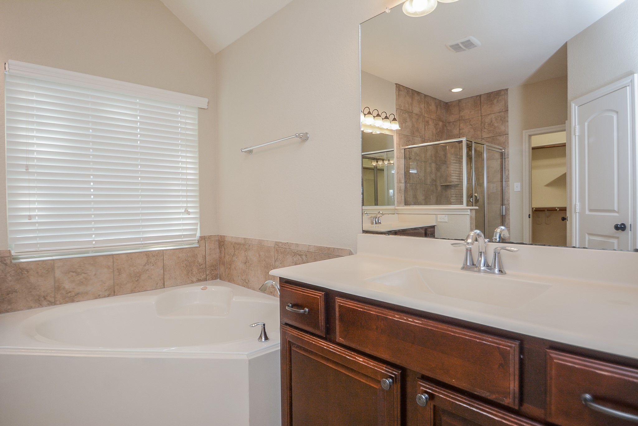 50 Sawbridge Court Spring, TX 77389 - Photo 17 of 32 a bathroom with a sink and a bathtub
