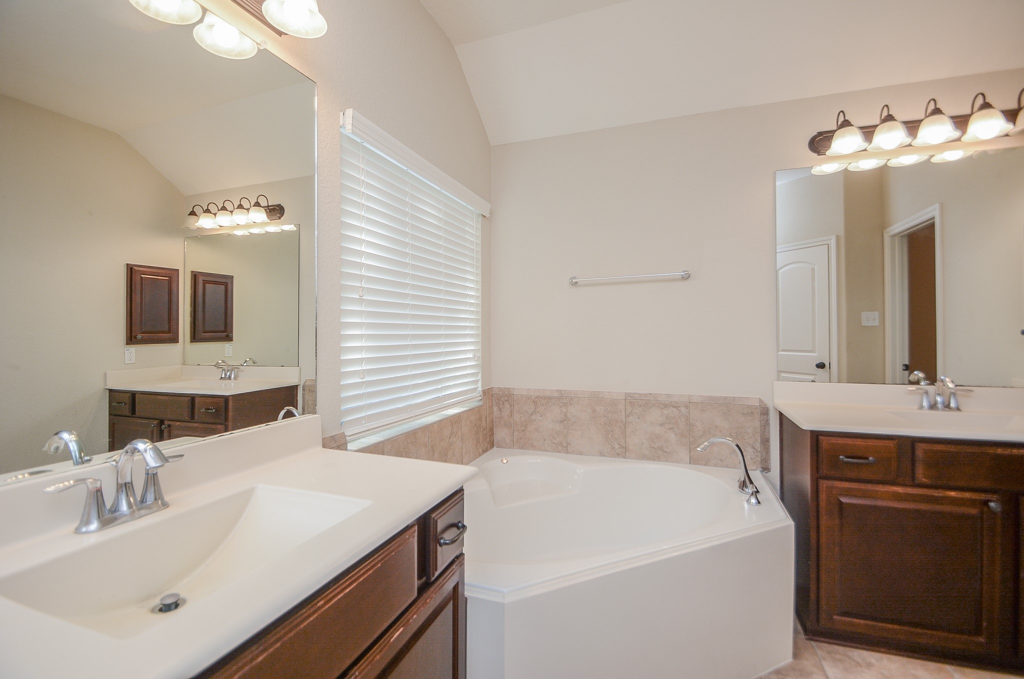 50 Sawbridge Court Spring, TX 77389 - Photo 19 of 32 a bathroom with a sink and a mirror