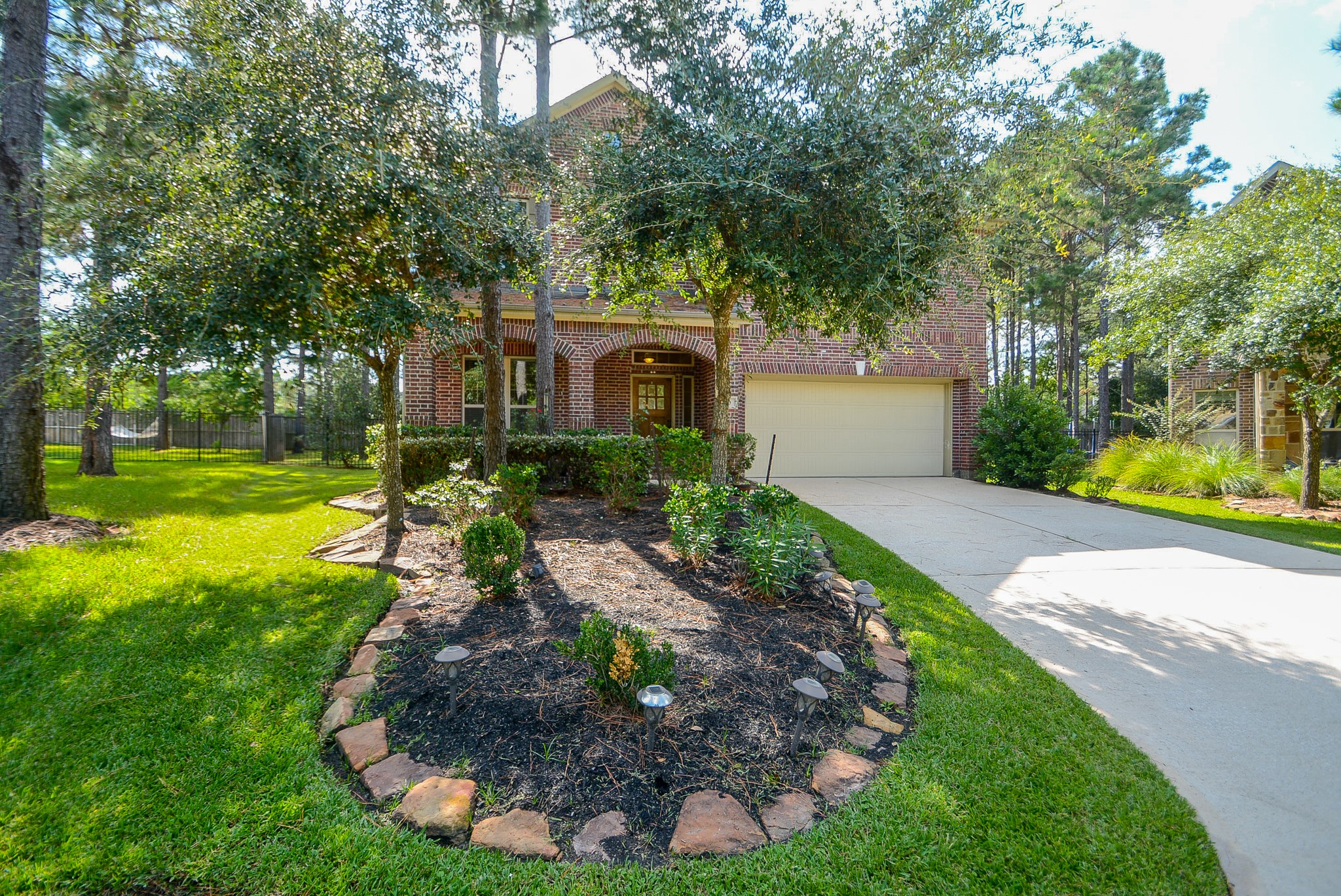 50 Sawbridge Court Spring, TX 77389 - Photo 2 of 32 a front view of a house with garden