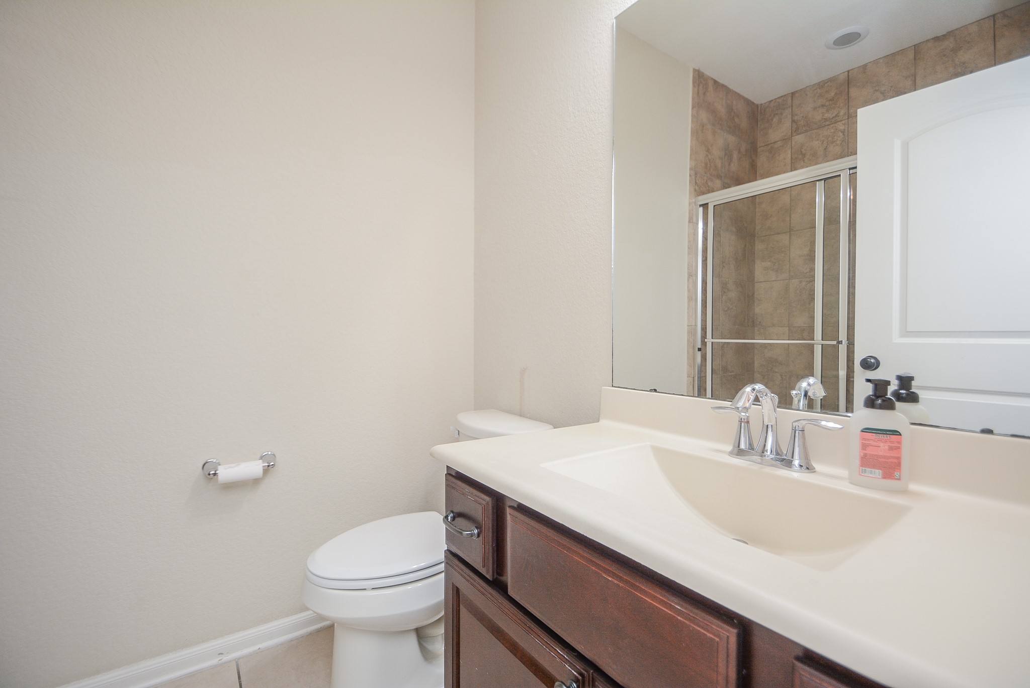50 Sawbridge Court Spring, TX 77389 - Photo 24 of 32 a bathroom with a sink toilet and a mirror
