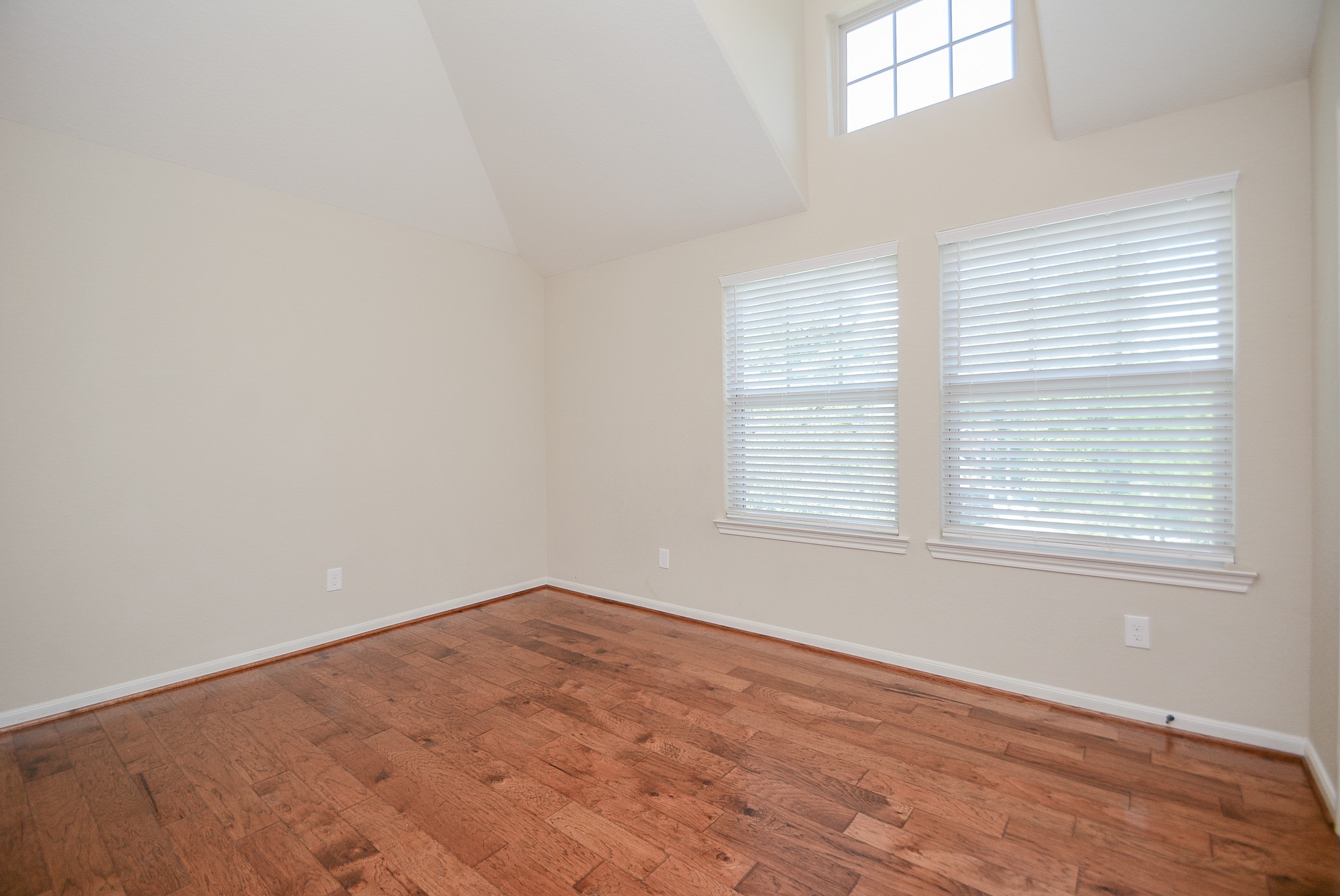 50 Sawbridge Court Spring, TX 77389 - Photo 26 of 32 an empty room with wooden floor and windows