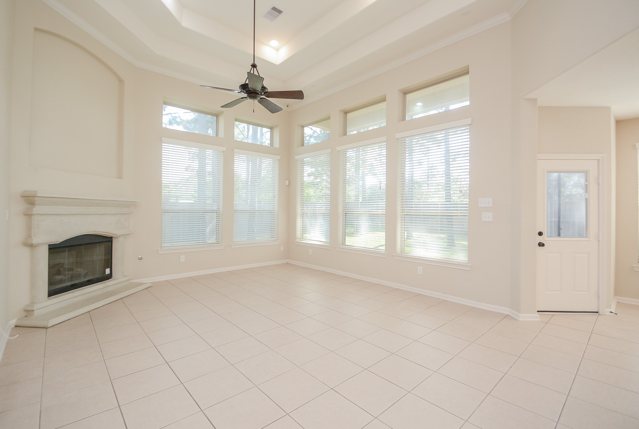 50 Sawbridge Court Spring, TX 77389 - Photo 6 of 32 a view of an empty room with chandelier fan and fire place