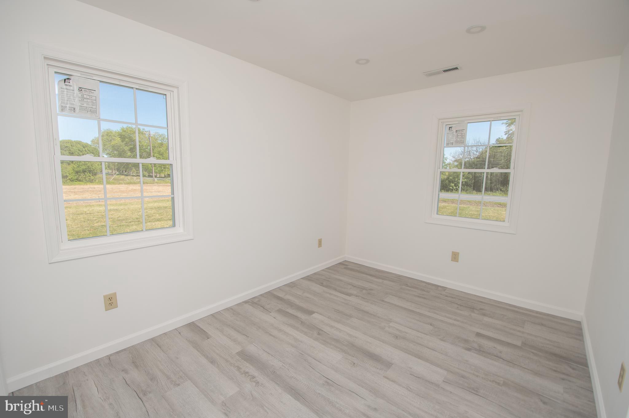 8707 Bacons Road Laurel, DE 19956 - Photo 13 of 18 an empty room with a window