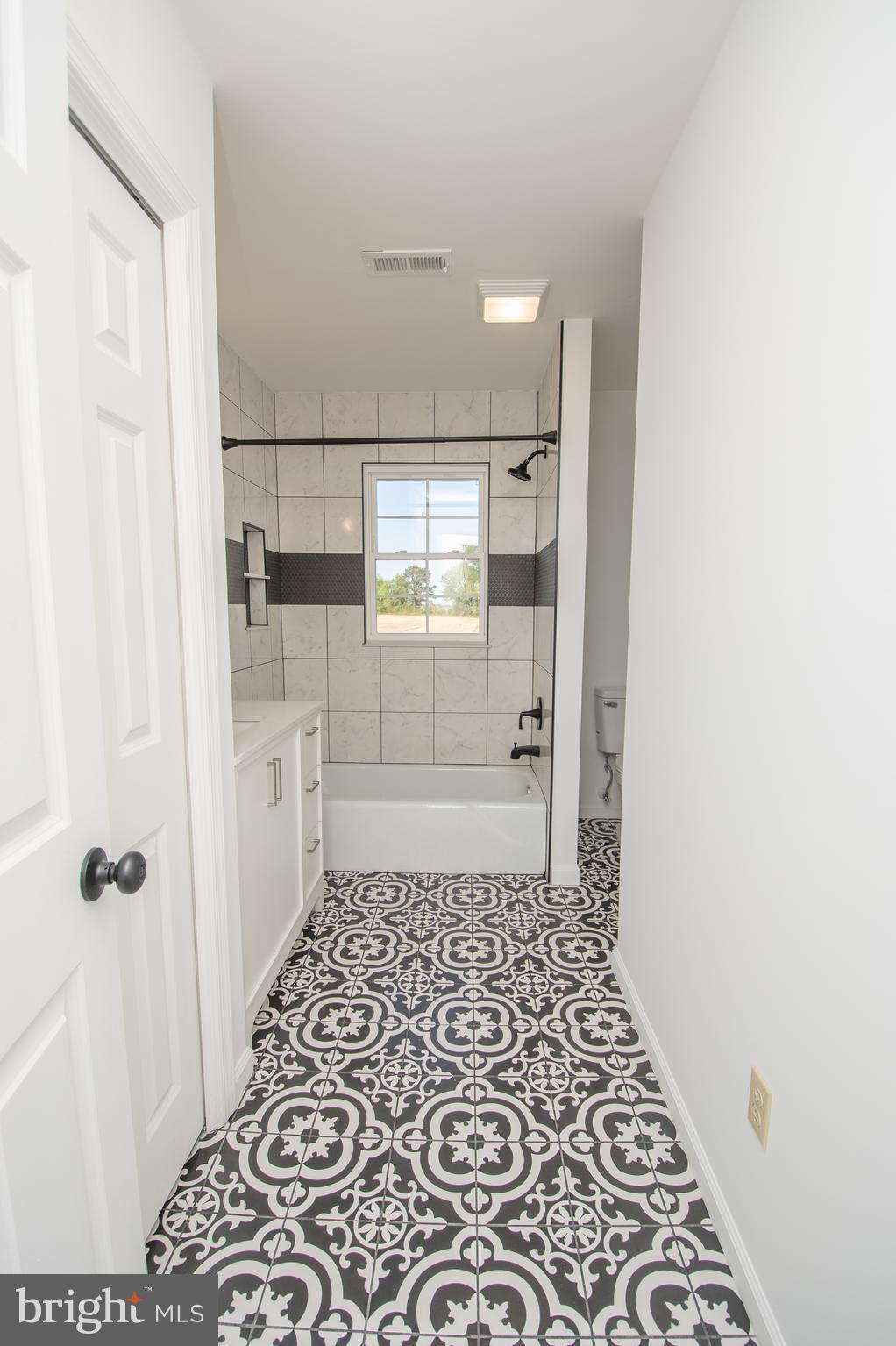 8707 Bacons Road Laurel, DE 19956 - Photo 10 of 18 a bathroom with a glass door shower