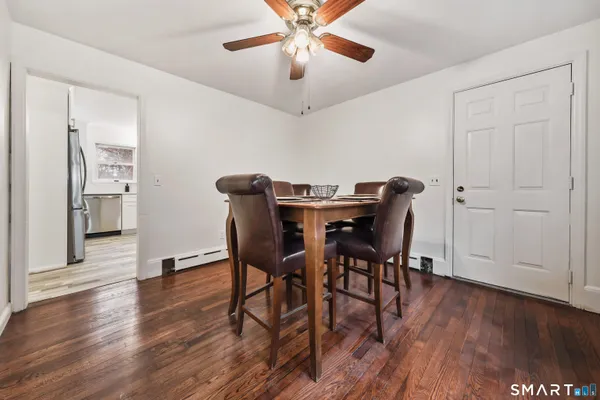 a bedroom with furniture and a wooden floor