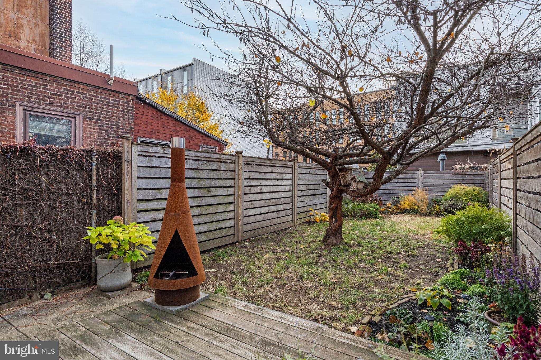 1418 East Columbia Avenue Philadelphia, PA 19125 - Photo 2 of 3 a plant that is sitting in front of a house