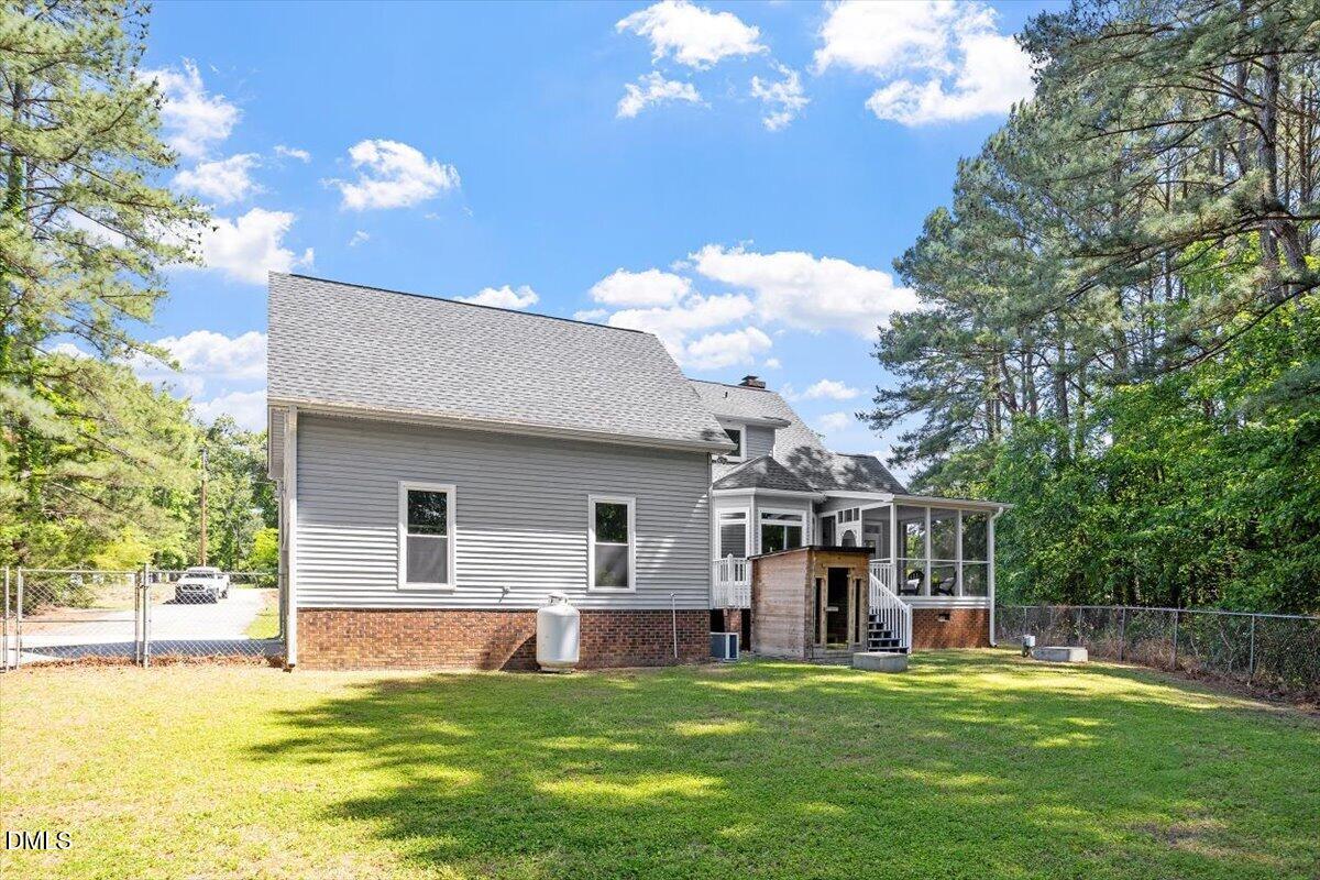 7505 Penny Road Raleigh, NC 27606 - Photo 6 of 35 a view of a house with a yard and swimming pool