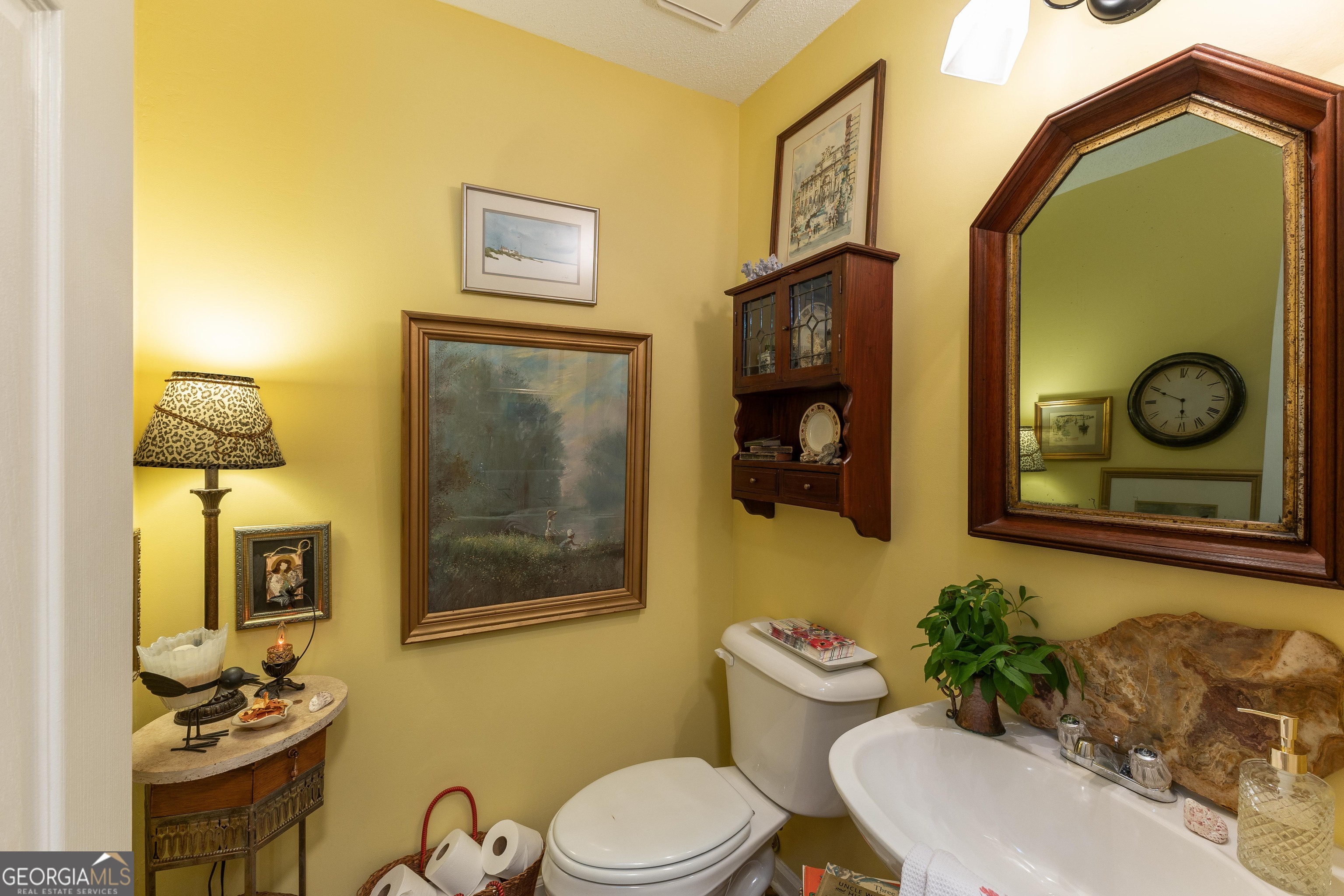 175 Weeping Willow Way Tyrone, GA 30290 - Photo 26 of 59 a bathroom with a toilet a sink and mirror