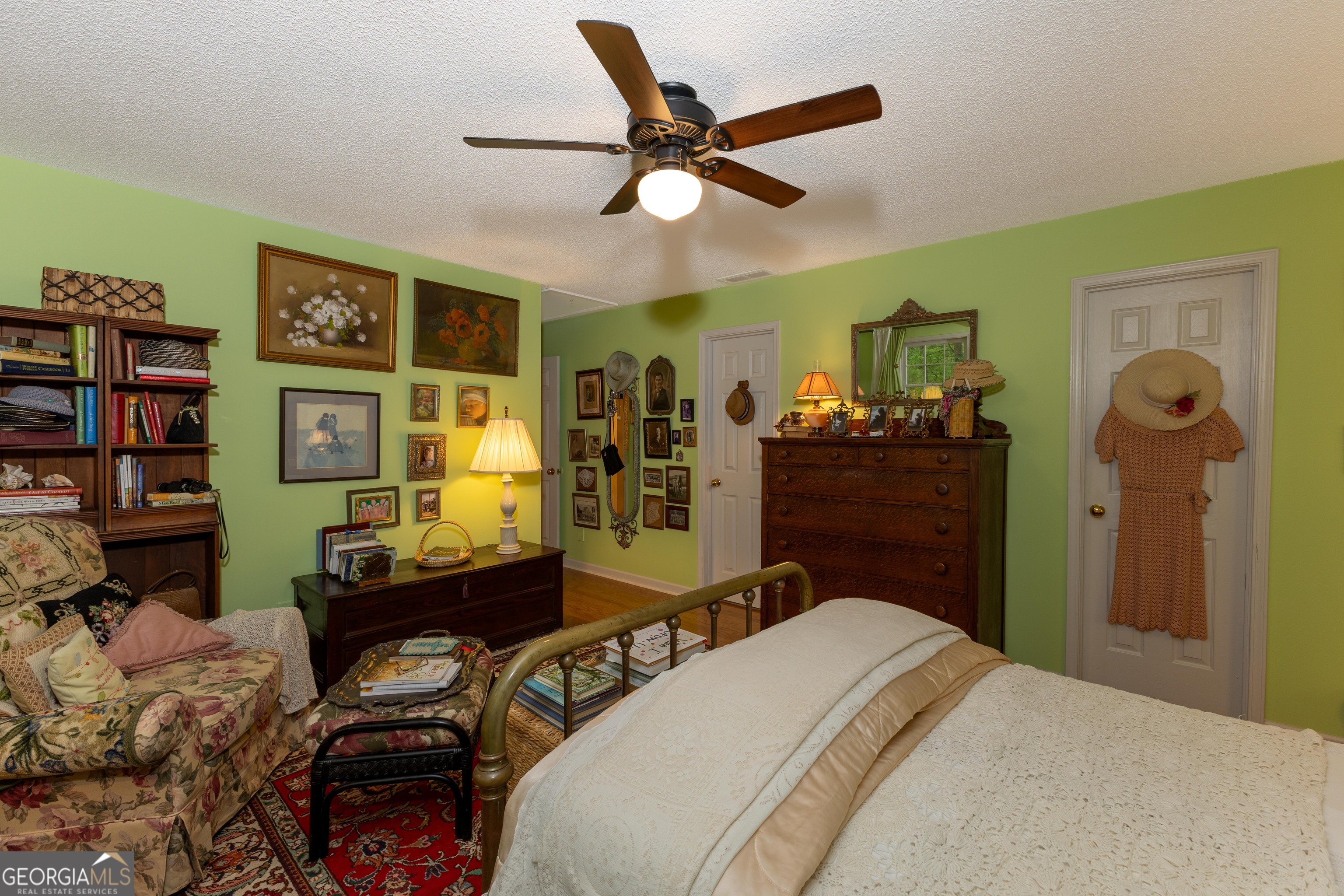 175 Weeping Willow Way Tyrone, GA 30290 - Photo 38 of 59 a bedroom with a bed and wooden floor