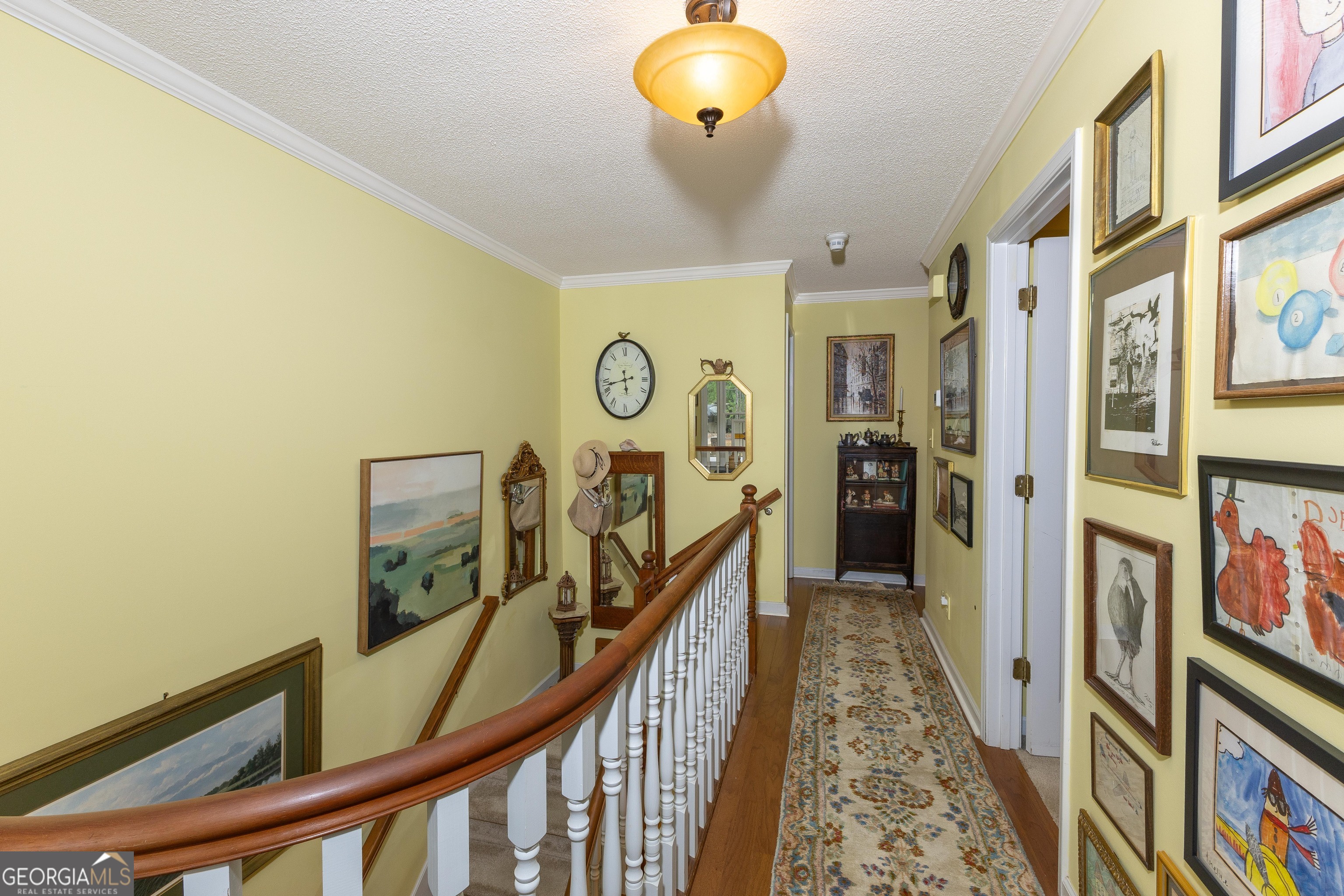 175 Weeping Willow Way Tyrone, GA 30290 - Photo 39 of 59 a view of a hallway with wooden floor and furniture