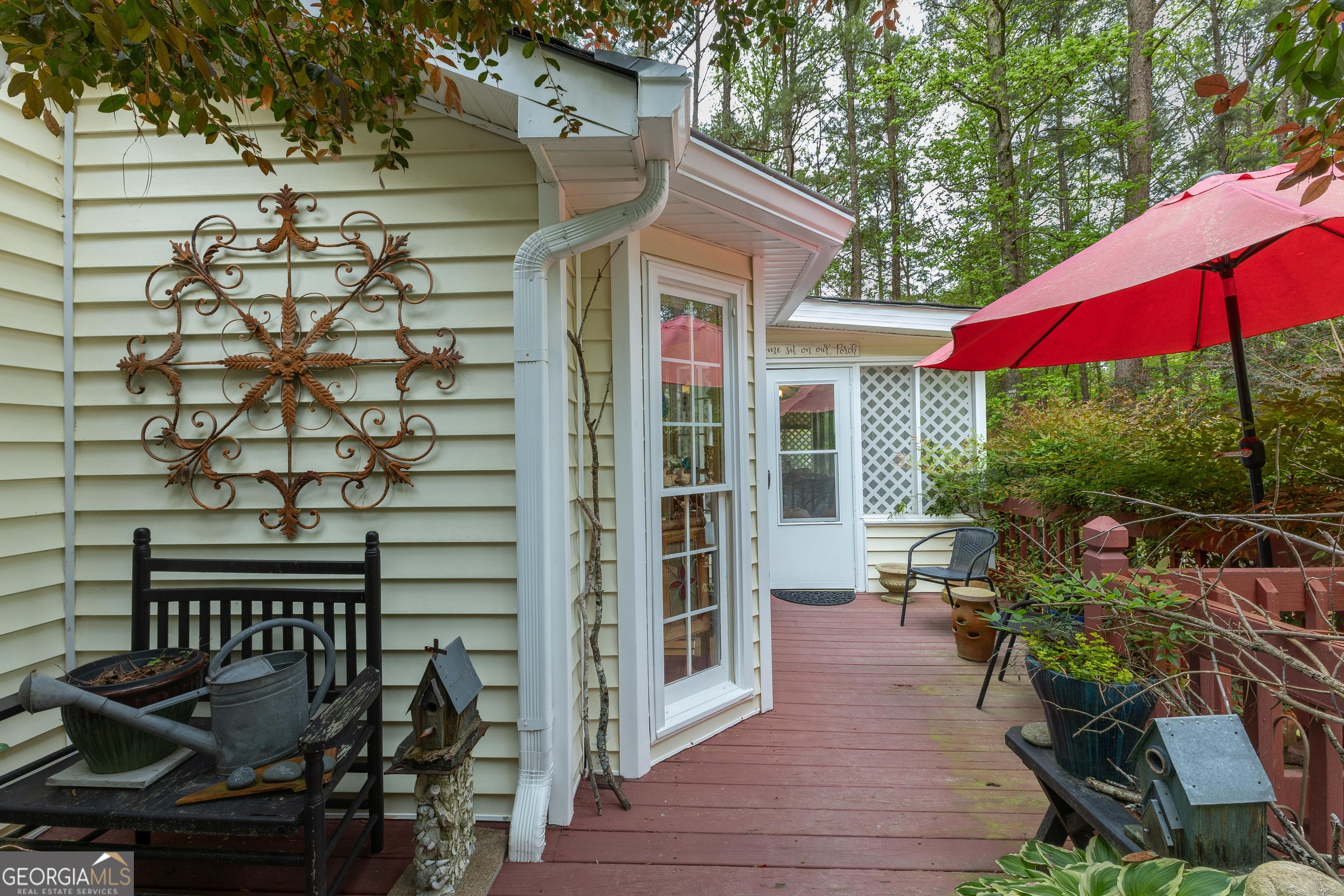 175 Weeping Willow Way Tyrone, GA 30290 - Photo 46 of 59 a view of a patio with table and chairs under an umbrella