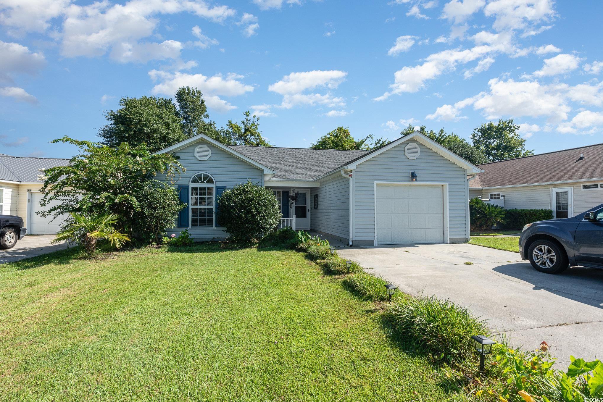 1005 Autumn Drive Murrells Inlet, SC 29576 - Photo 1 of 25 Single story home featuring a garage and a front l