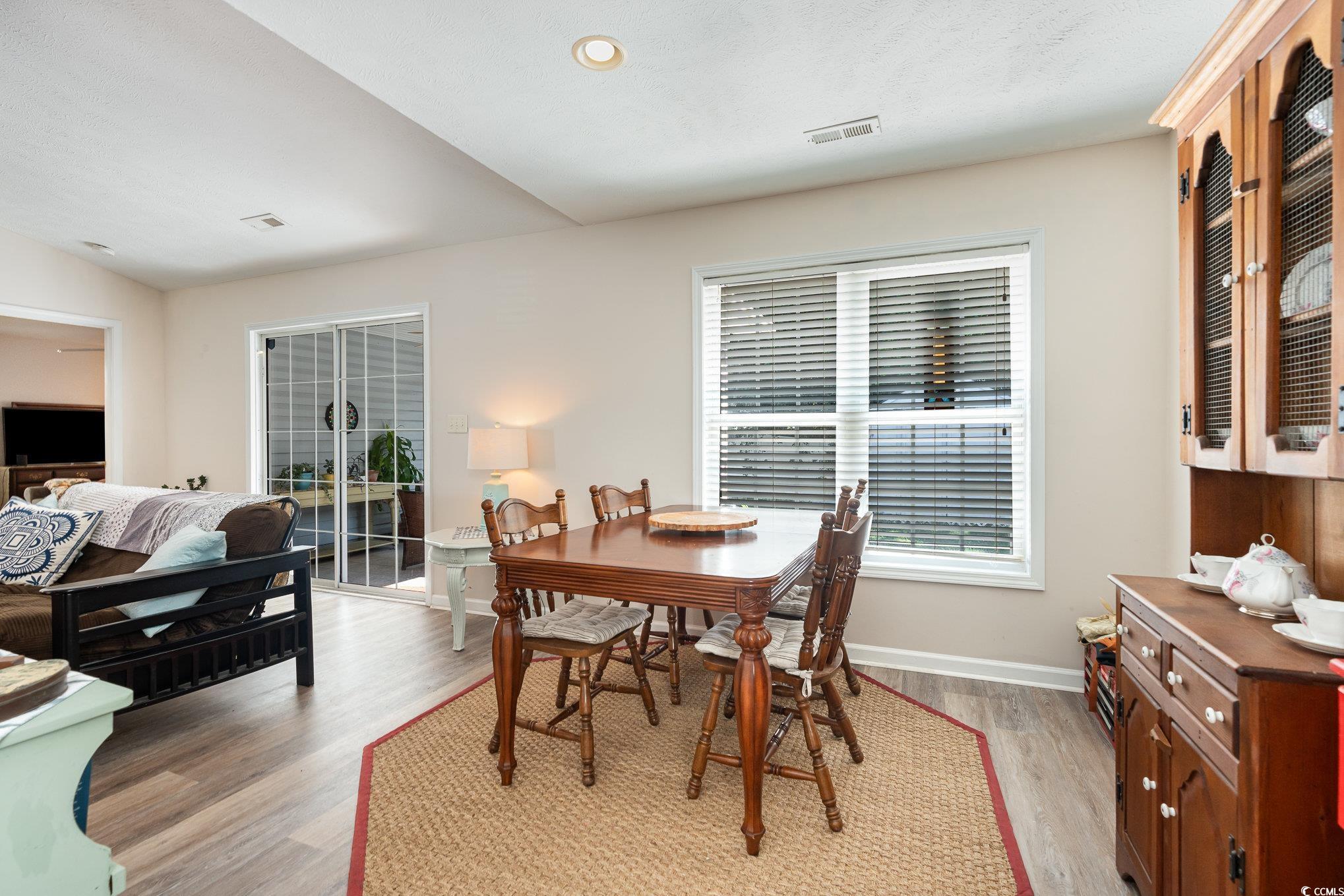 1005 Autumn Drive Murrells Inlet, SC 29576 - Photo 11 of 25 Dining room with light hardwood / wood-style floor
