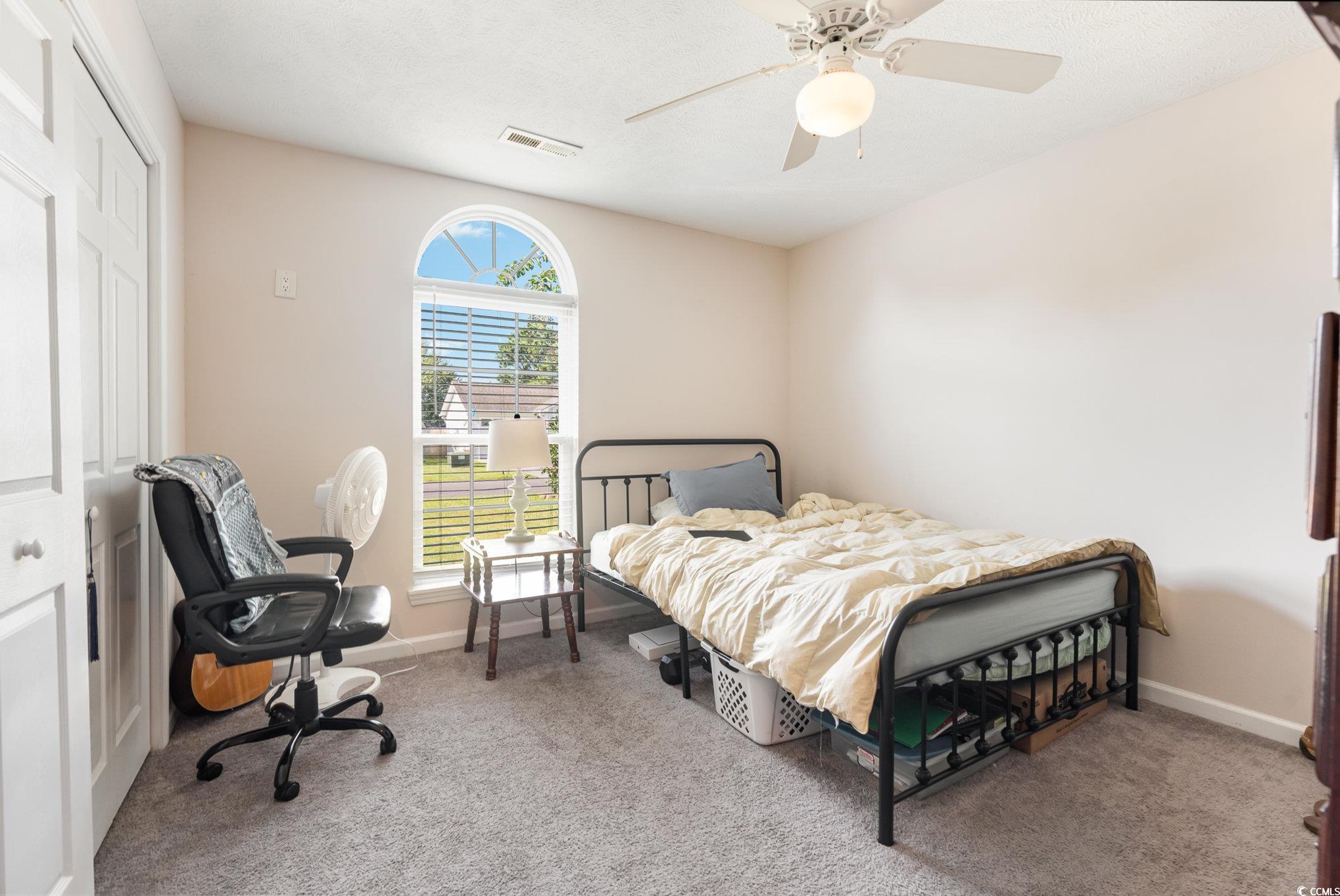 1005 Autumn Drive Murrells Inlet, SC 29576 - Photo 17 of 25 Carpeted bedroom featuring a closet and ceiling fa