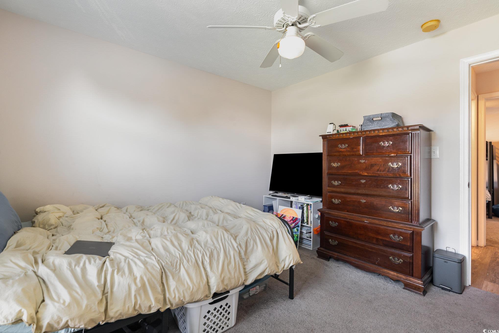 1005 Autumn Drive Murrells Inlet, SC 29576 - Photo 18 of 25 Carpeted bedroom with ceiling fan