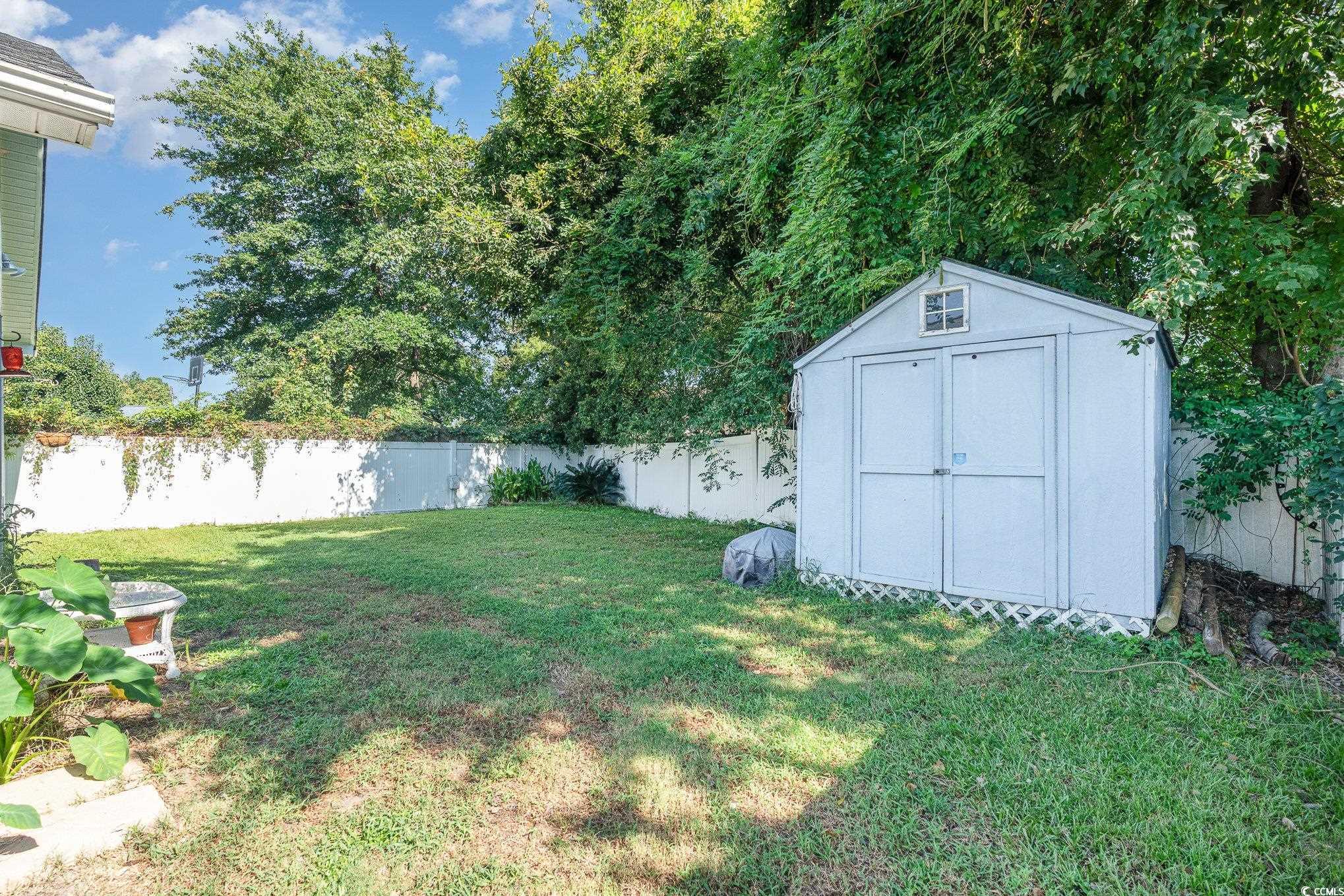 1005 Autumn Drive Murrells Inlet, SC 29576 - Photo 5 of 25 View of yard featuring a shed