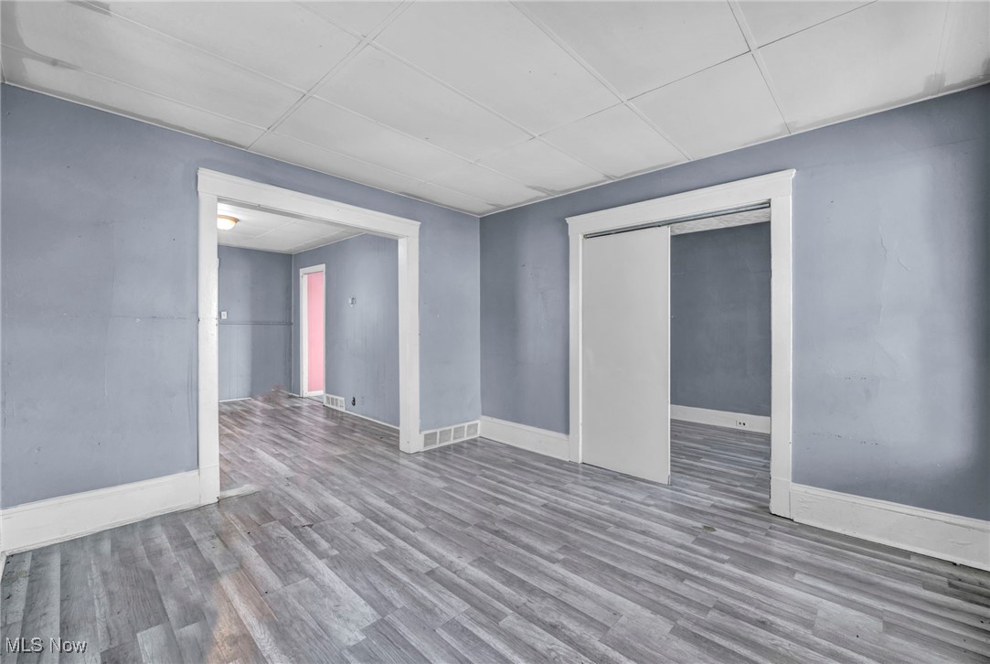 3405 Roehl Avenue Cleveland, OH 44109 - Photo 10 of 50 Empty room featuring wood finished floors and baseboards