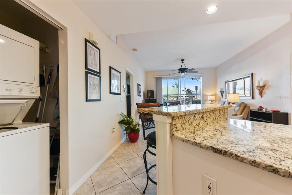 2060 Matecumbe Key Road, Unit 2107 Punta Gorda, FL 33955 - Photo 11 of 44 a kitchen with stainless steel appliances granite countertop sink refrigerator and cabinets