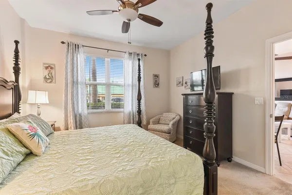 a bedroom with a bed and a television