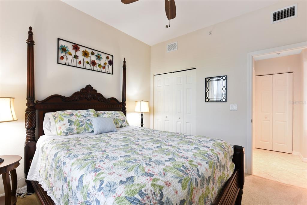 2060 Matecumbe Key Road, Unit 2107 Punta Gorda, FL 33955 - Photo 21 of 44 a bedroom with a bed and a painting on the wall