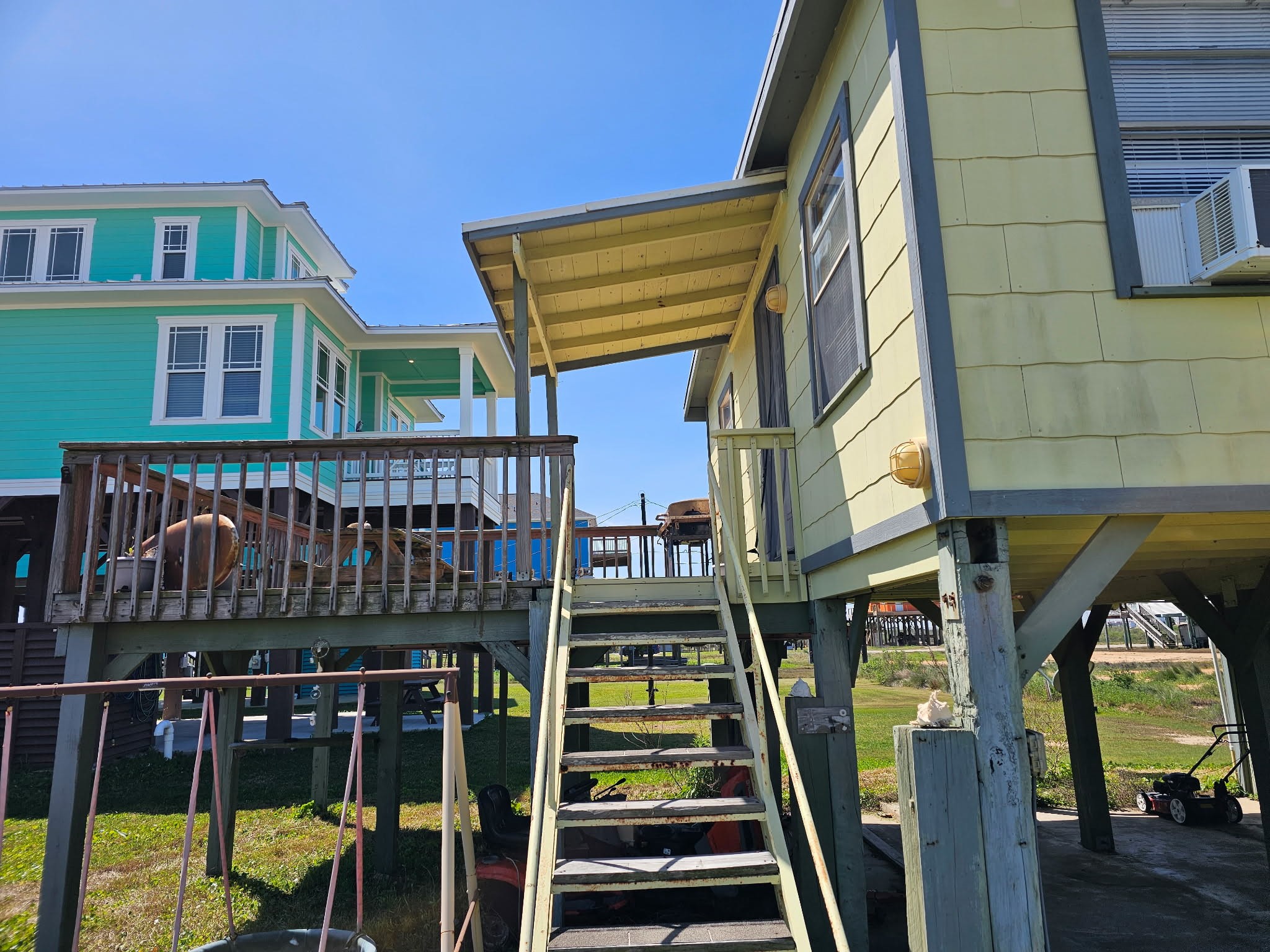 a view of a house with balcony and wooden floor