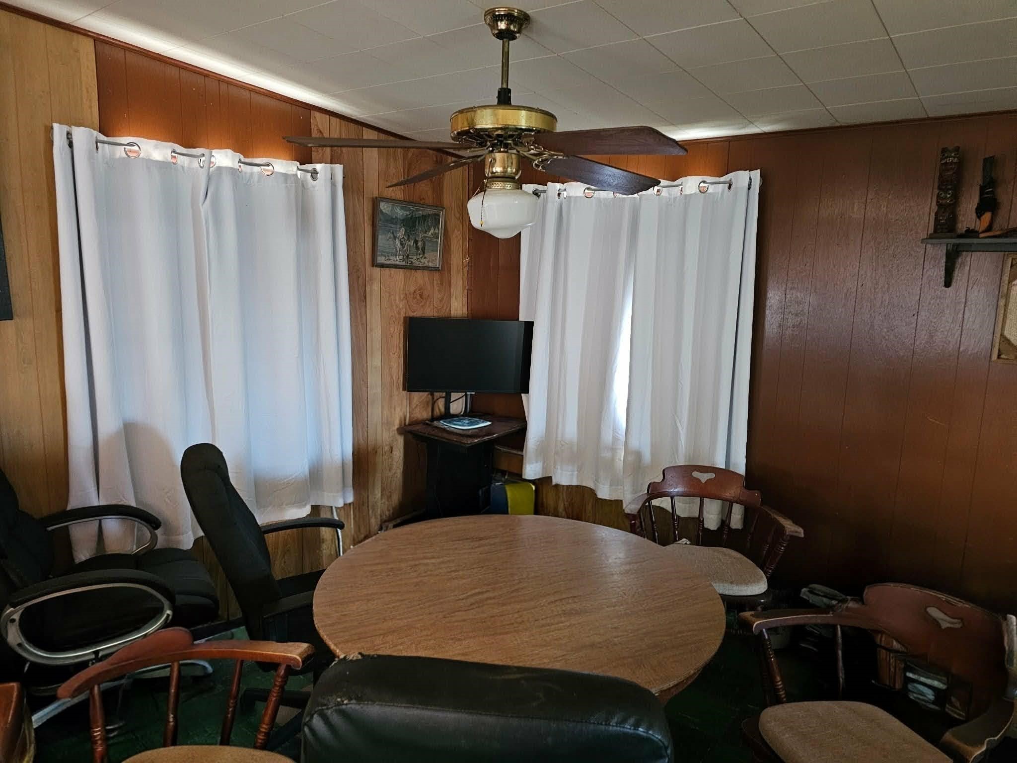 605 Texas Street Surfside Beach, TX 77541 - Photo 8 of 8 a dining room with furniture and window