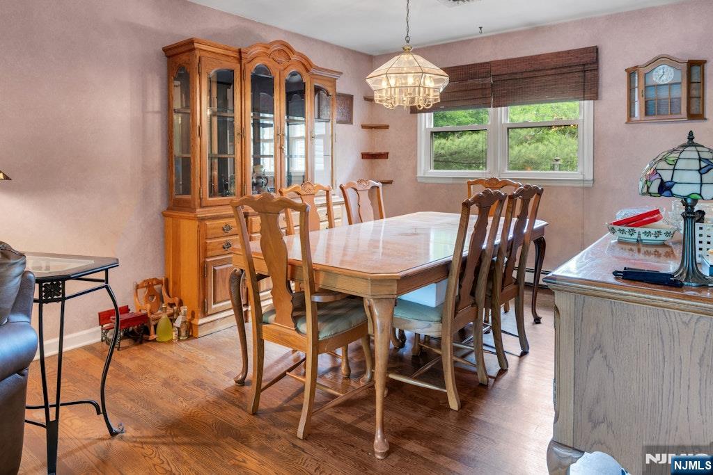 185 Ratzer Road Wayne, NJ 07470 - Photo 13 of 36 a view of a dining room with furniture window and outside view