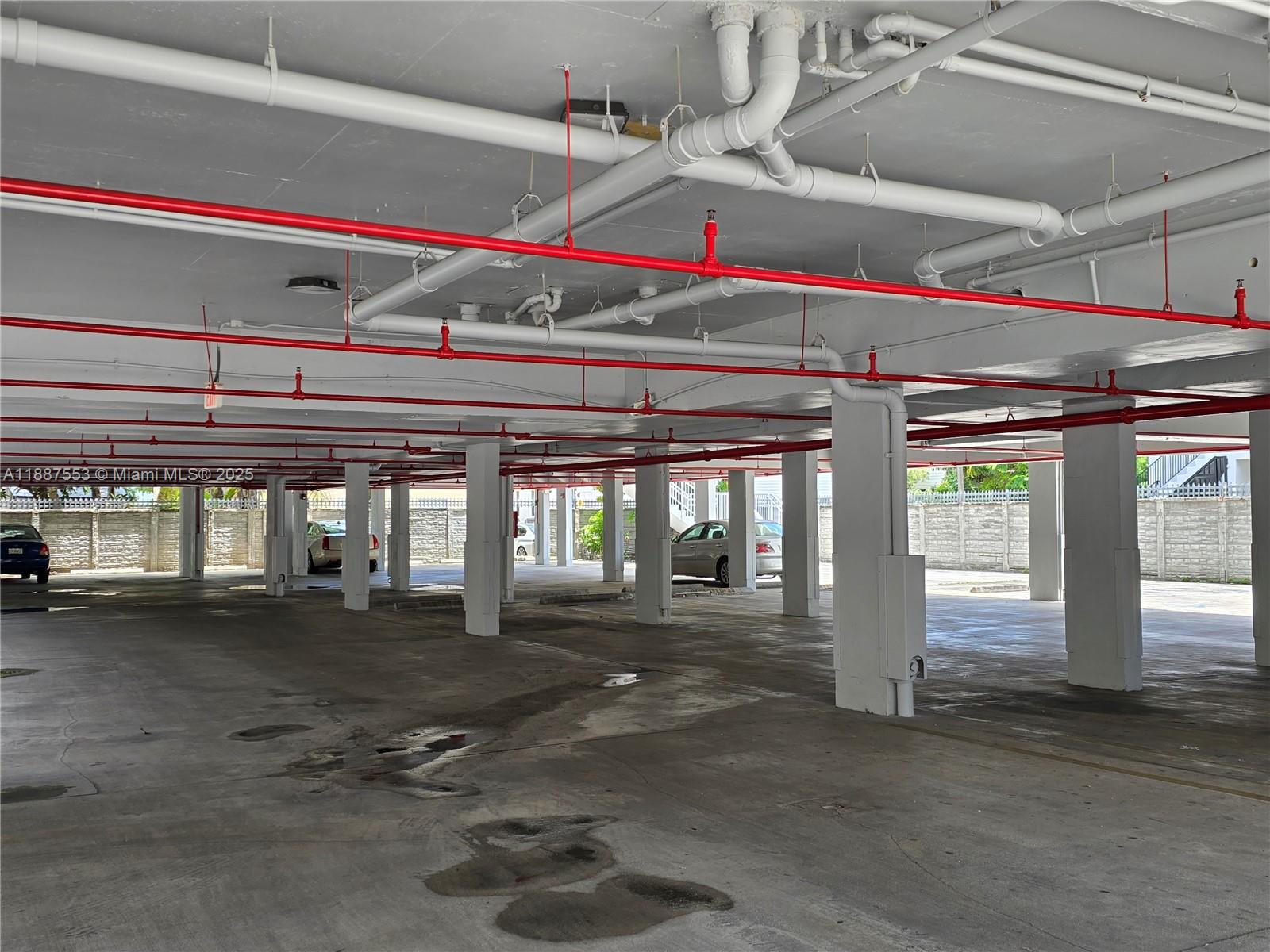 637 Southwest 3rd Street, Unit 404 Miami, FL 33130 - Photo 12 of 14 a room with lots of windows and open kitchen