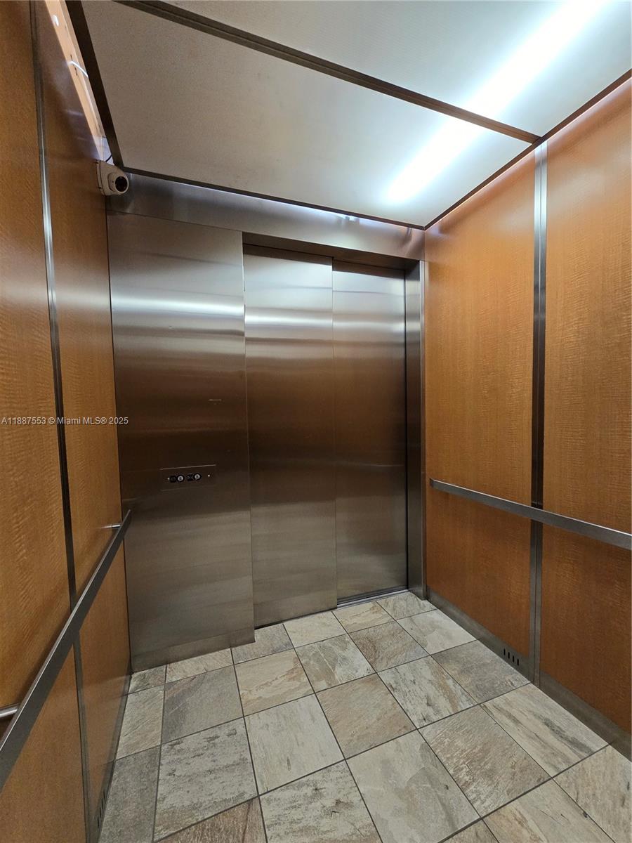 637 Southwest 3rd Street, Unit 404 Miami, FL 33130 - Photo 14 of 14 a bathroom with a glass door shower