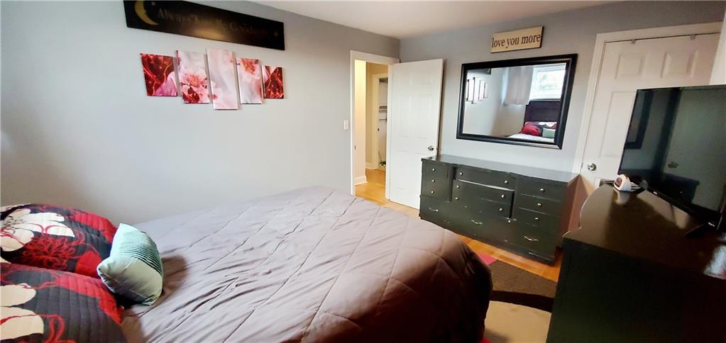 8117 Peebles Road Pittsburgh, PA 15237 - Photo 10 of 20 a bedroom with a bed and a flat screen tv