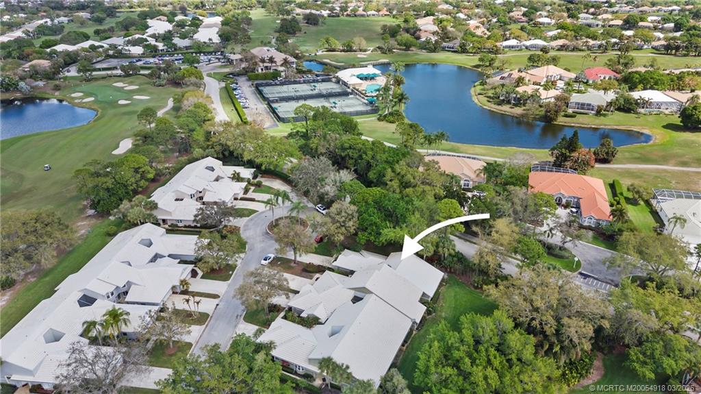 2437 Southwest Foxpoint Trail Palm City, FL 34990 - Photo 40 of 60 an aerial view of a houses with outdoor space