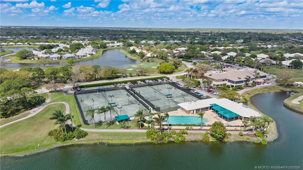 2437 Southwest Foxpoint Trail Palm City, FL 34990 - Photo 43 of 60 an aerial view of residential houses with outdoor space