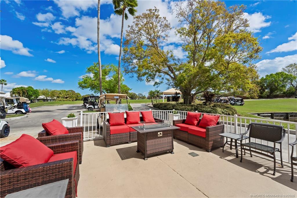 2437 Southwest Foxpoint Trail Palm City, FL 34990 - Photo 52 of 60 a outdoor space with patio furniture