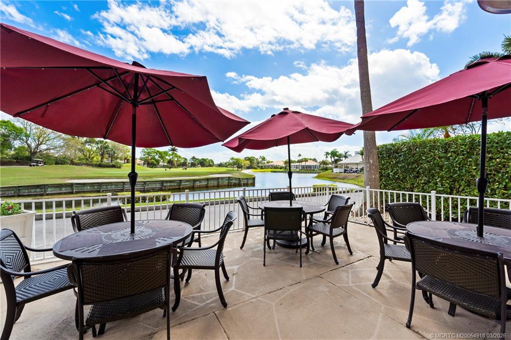 2437 Southwest Foxpoint Trail Palm City, FL 34990 - Photo 53 of 60 a view of chairs and table in the patio