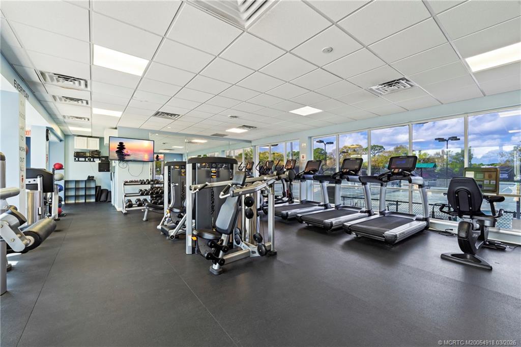 2437 Southwest Foxpoint Trail Palm City, FL 34990 - Photo 56 of 60 a view of a room with gym equipment