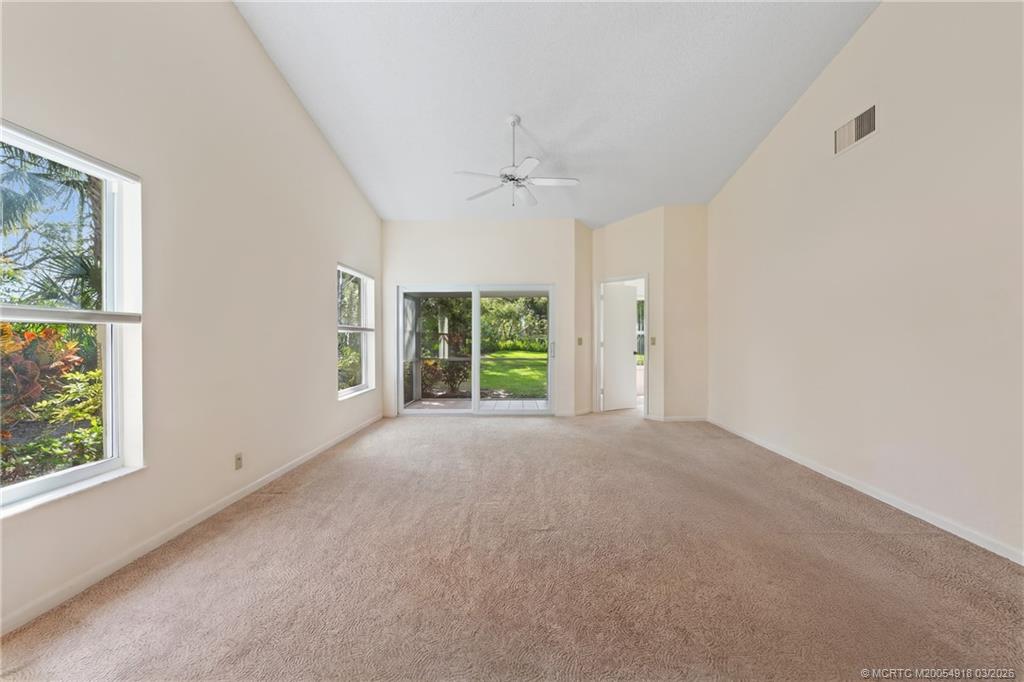 2437 Southwest Foxpoint Trail Palm City, FL 34990 - Photo 6 of 60 an empty room with windows and closet