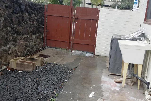 a bathroom with a granite countertop toilet and a sink