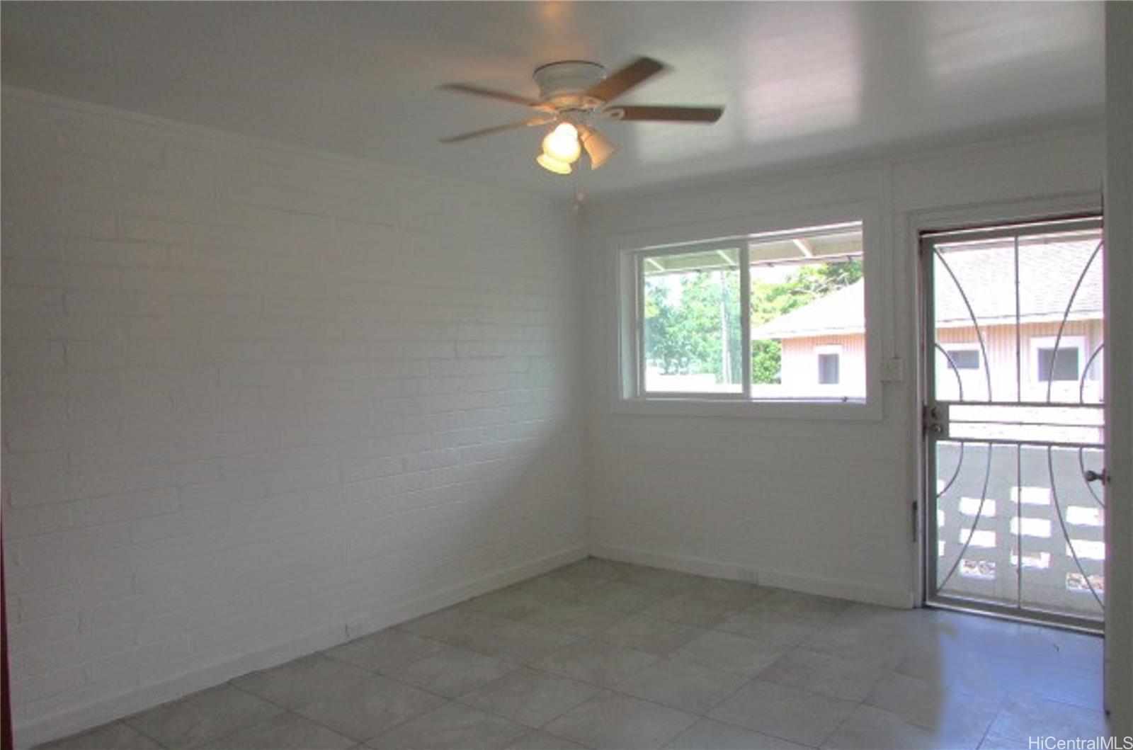 1449 Punchbowl Street Honolulu, HI 96813 - Photo 9 of 18 an empty room with windows and fan