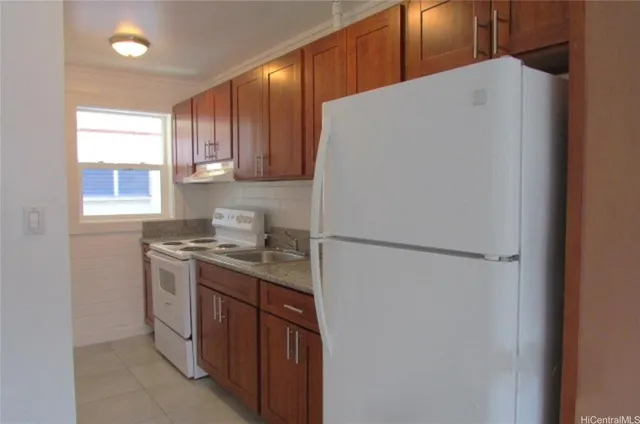 a view of a backyard with chairs and a stove