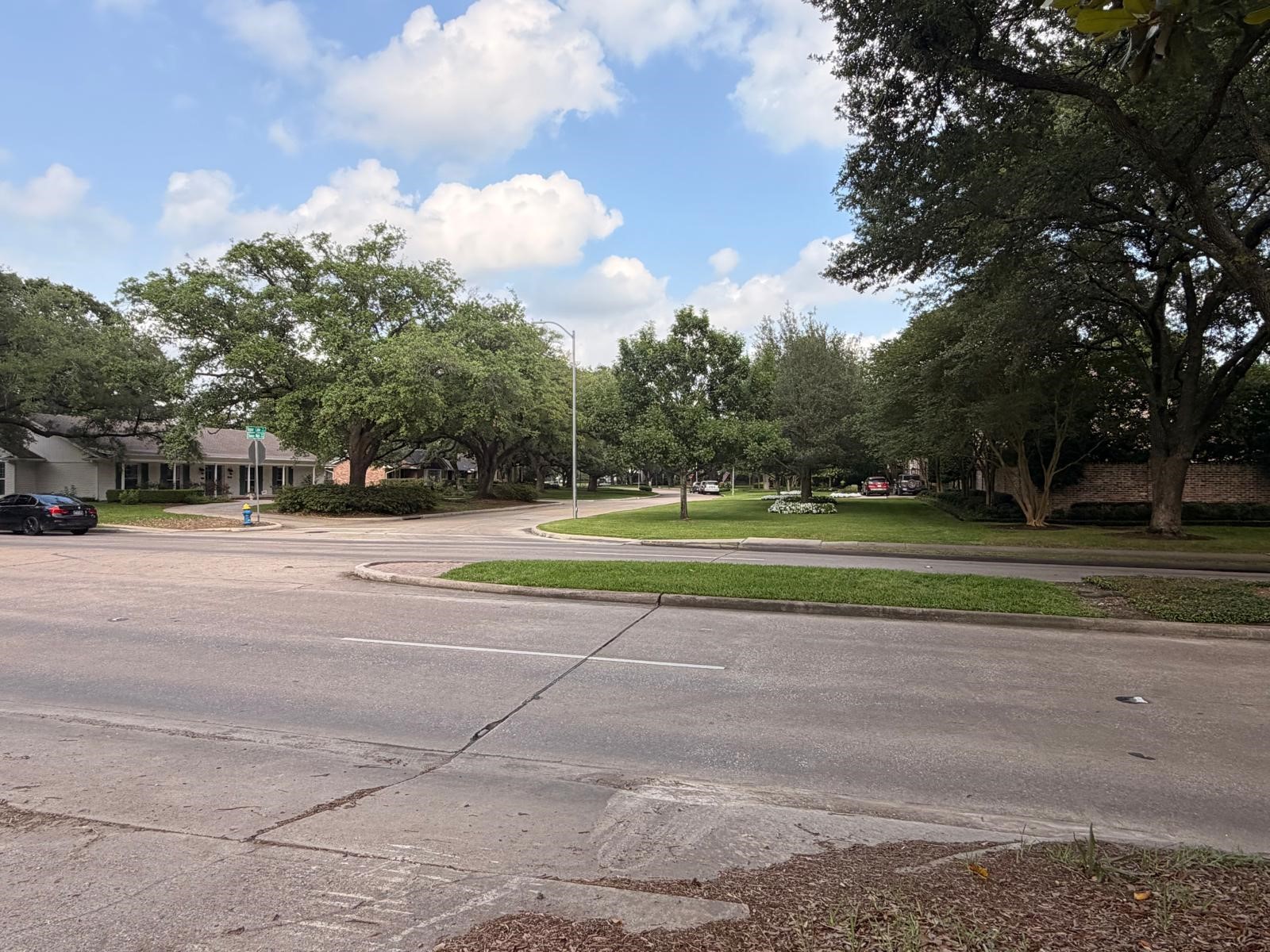 802 Chimney Rock Road Houston, TX 77057 - Photo 2 of 7 a view of a tennis ground with large trees
