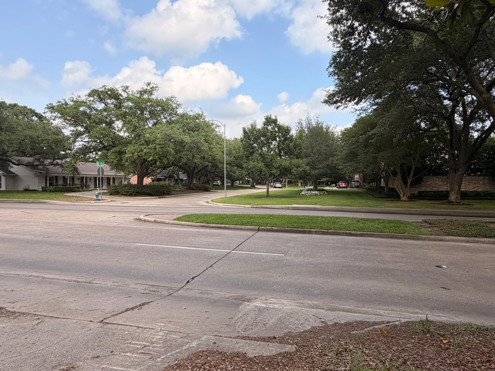 802 Chimney Rock Road Houston, TX 77057 - Photo 5 of 7 a view of a tennis ground with large trees